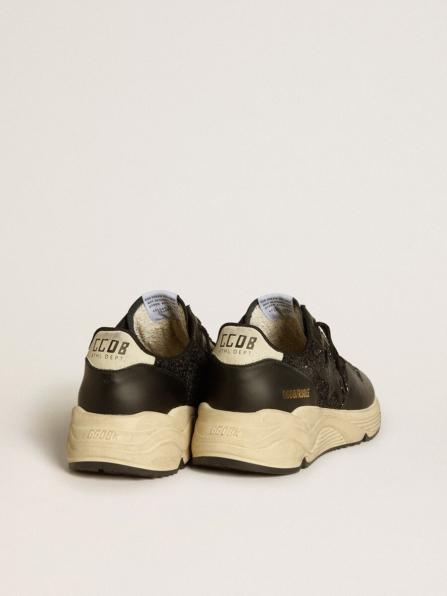 dames hardloopzool in zwart met glitter leren ster en hielstuk van nubuck.
