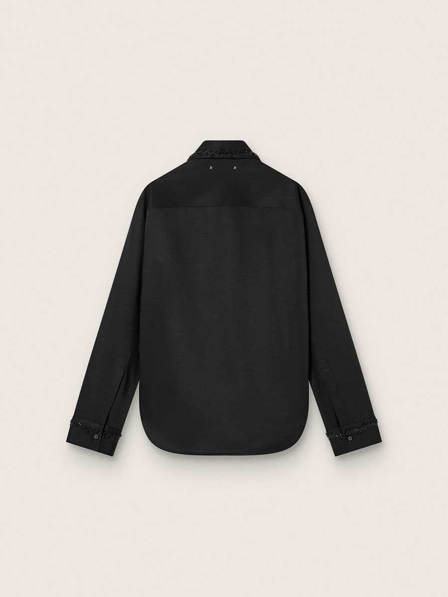 damesblouse van zwarte wollen keperstof met bloemenborduurwerk van glaskralen.