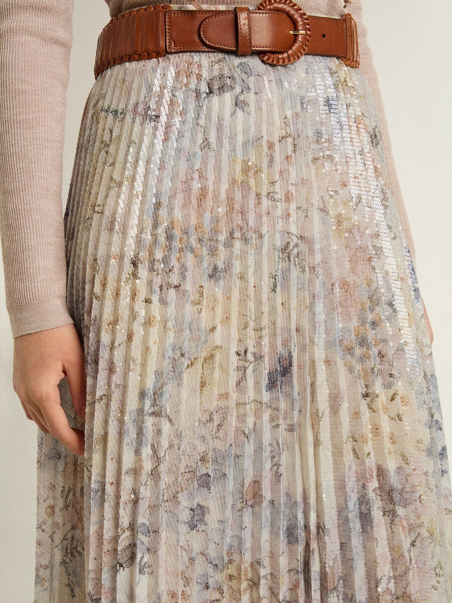 lange geplooide damesrok met veelkleurige bloemenprint van pailletten.