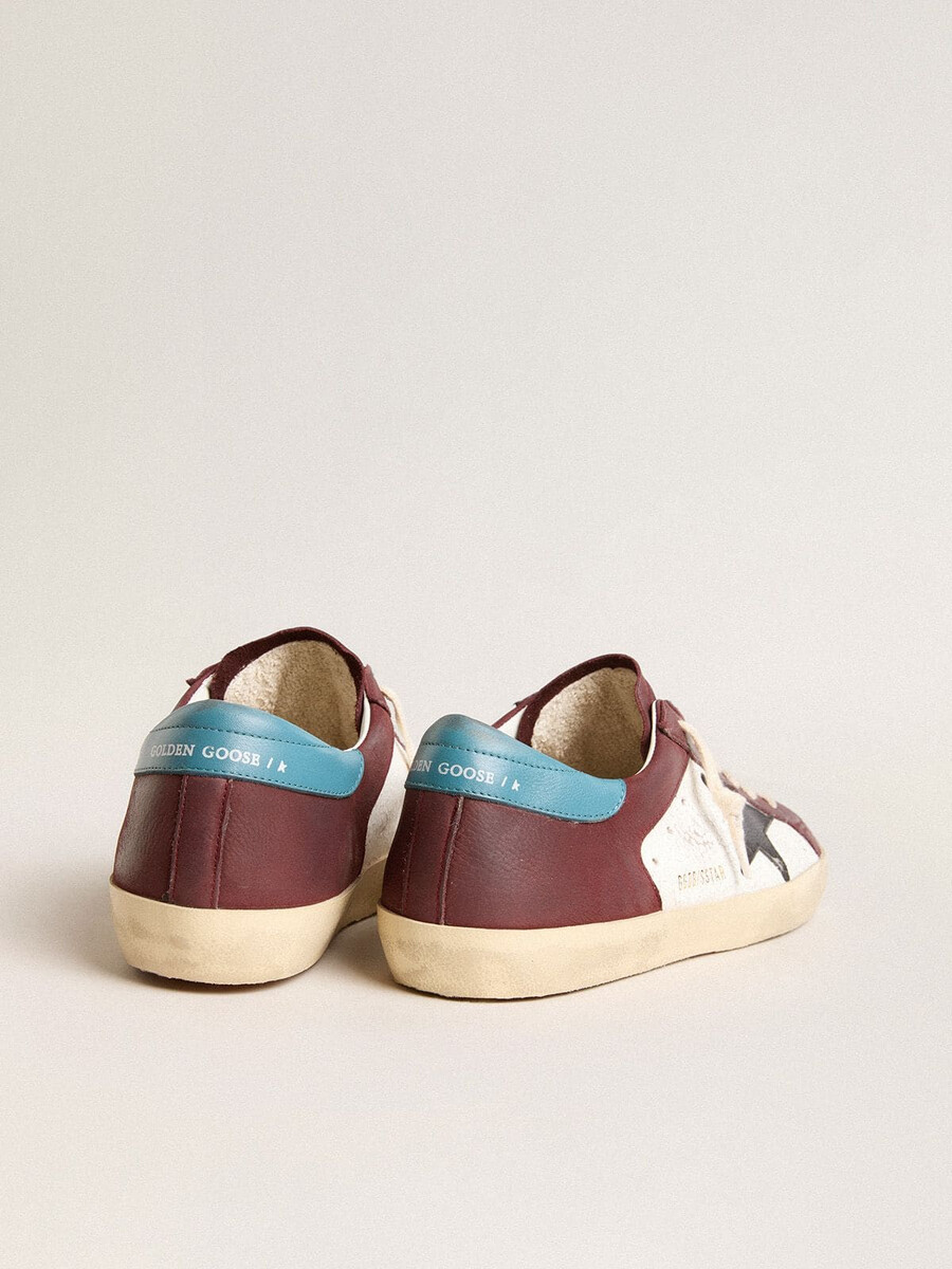 heren super-star in craquelé leer met bruine ster en turquoise hielstuk.