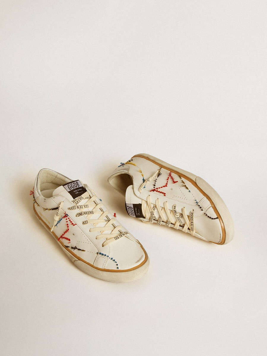 heren super-star ltd met geperforeerde ster en metallic leren hielstuk.