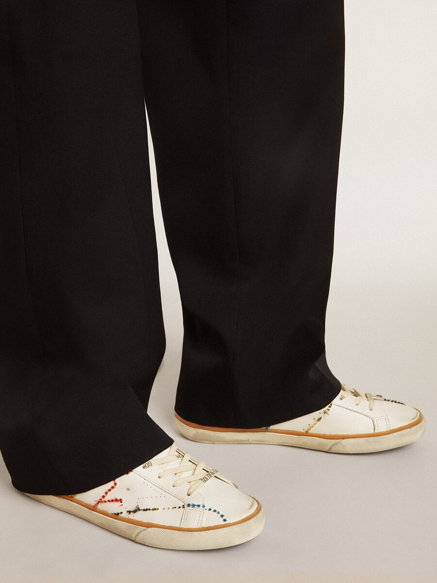 heren super-star ltd met geperforeerde ster en metallic leren hielstuk.