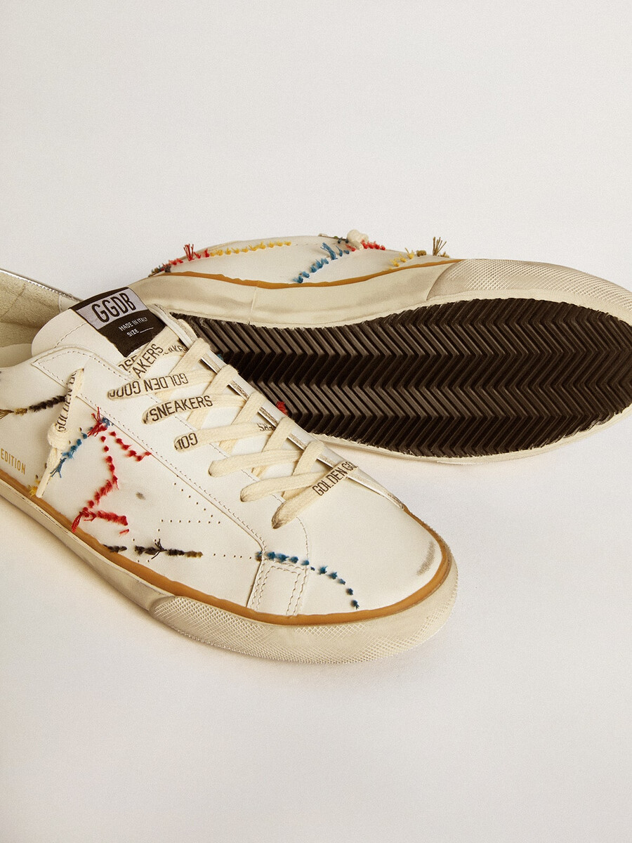 heren super-star ltd met geperforeerde ster en metallic leren hielstuk.
