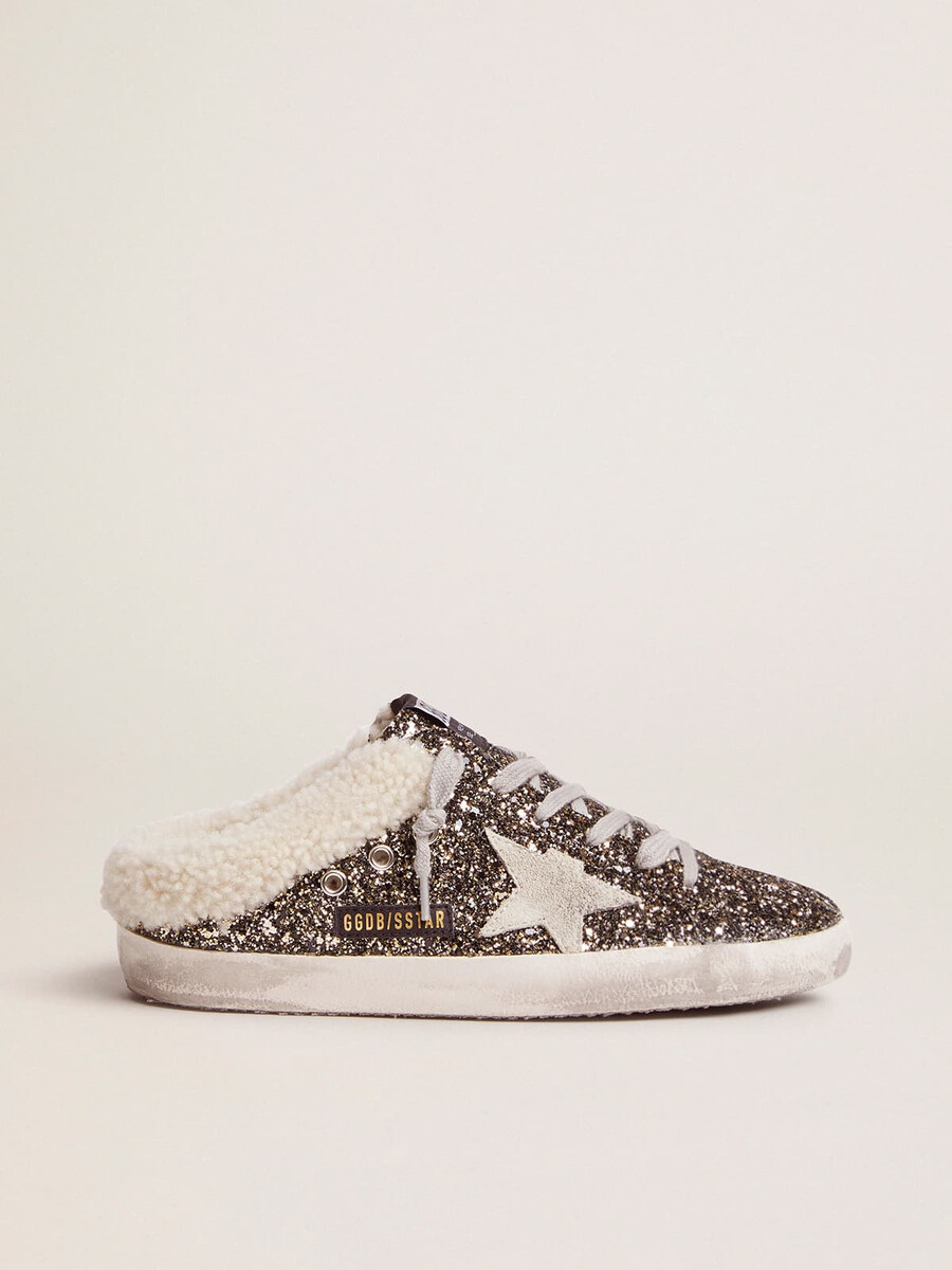 dames super-star sabot met glitter en schapenvachtvoering.