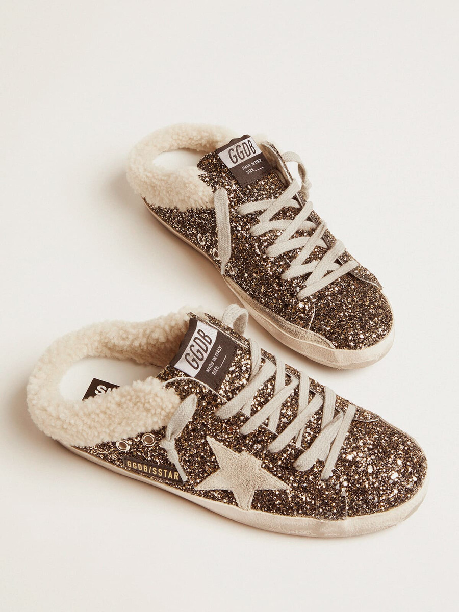 dames super-star sabot met glitter en schapenvachtvoering.