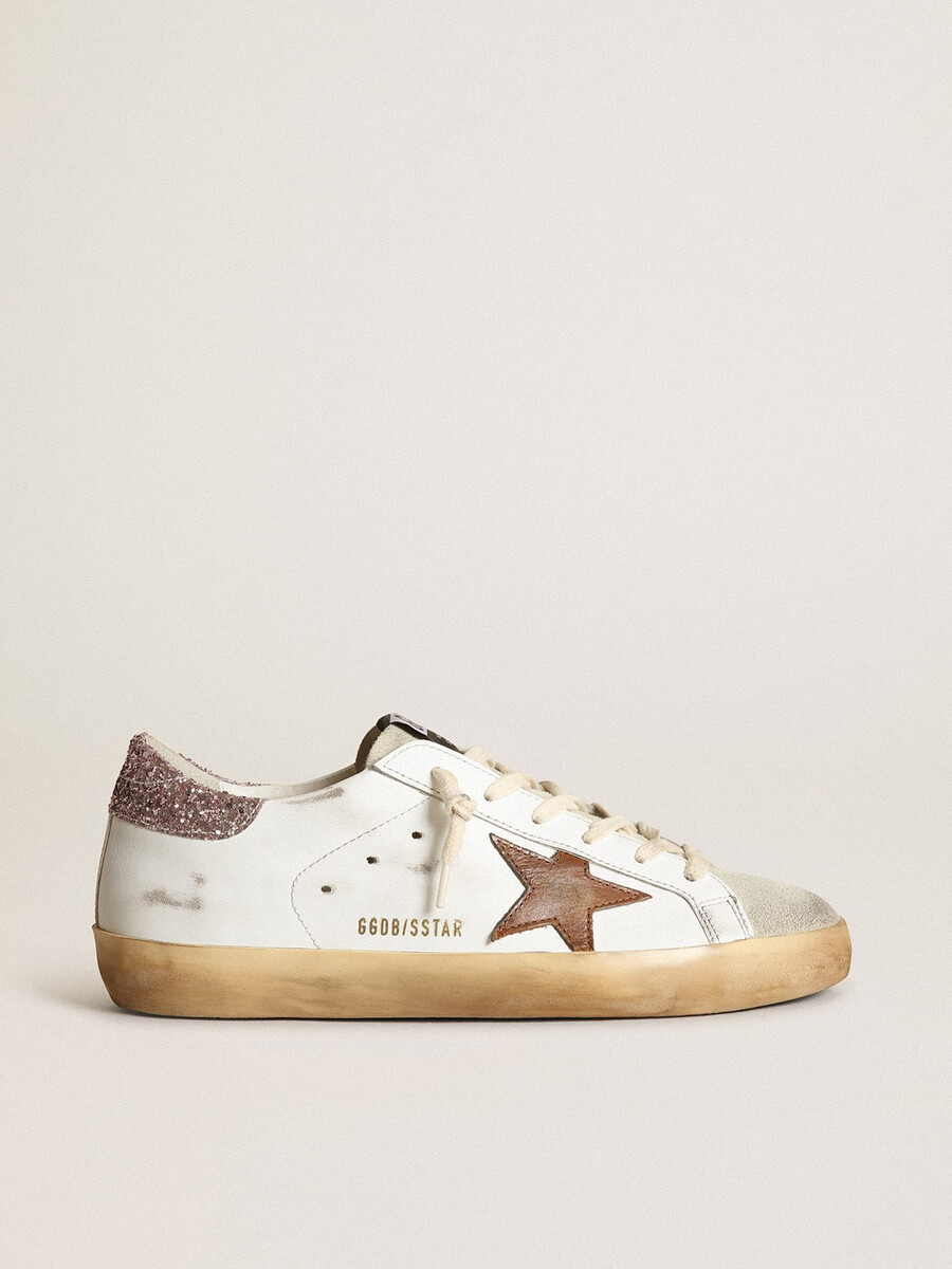 superster met een beige ster en een roze glitterhielstukje.