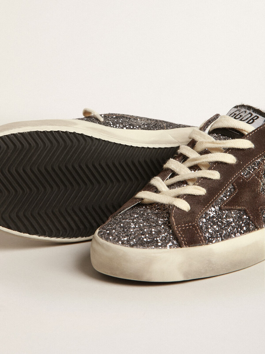 superster in glitter met een bruine ster en lila hielstukje