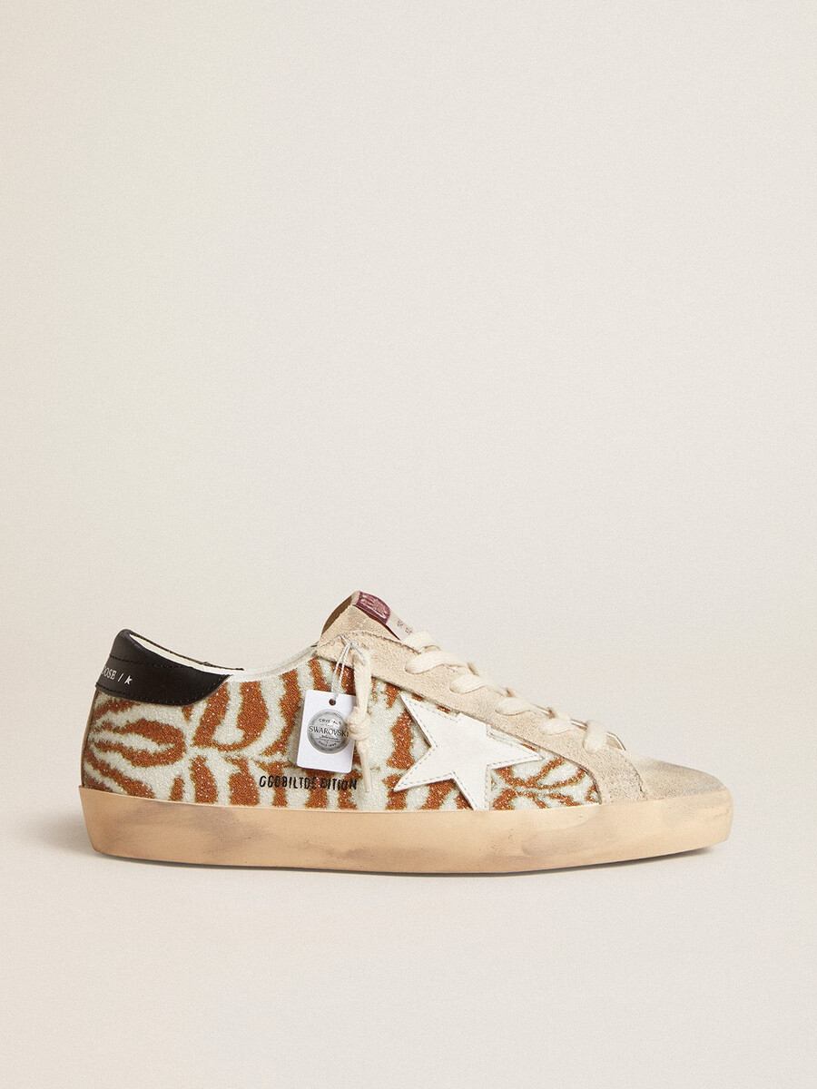 superster in zebraprint van swarovski met een witte leren ster.