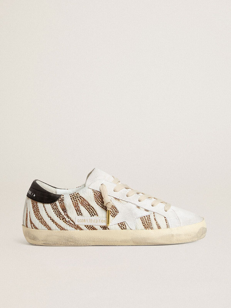dames super-star ltd in wit ponyhaar met bruine glitter en witte suède ster.
