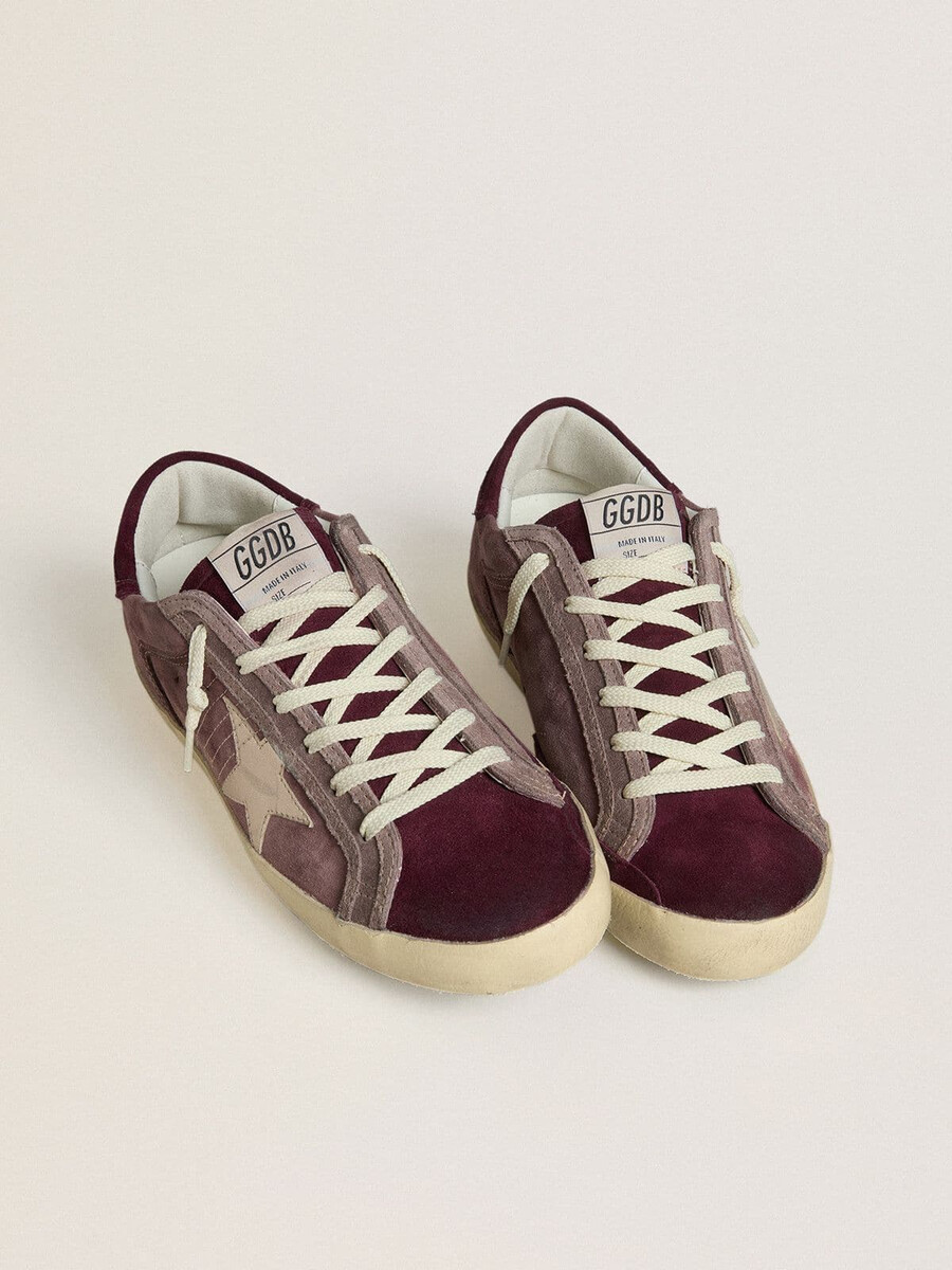 dames super-star ltd in lila suède met zilverkleurige metallic leren ster en suède hielstuk.