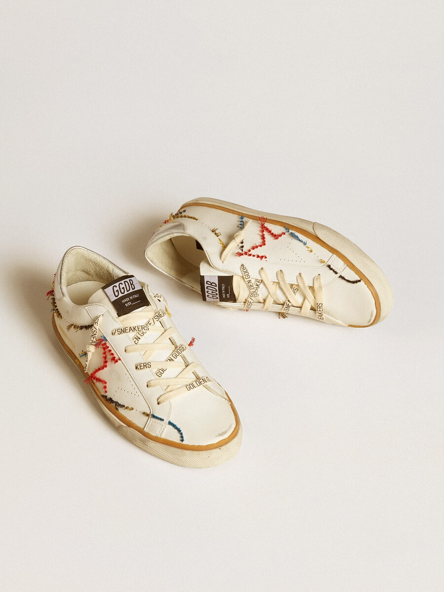 dames super-star ltd met geperforeerde ster en metallic leren hielstuk.