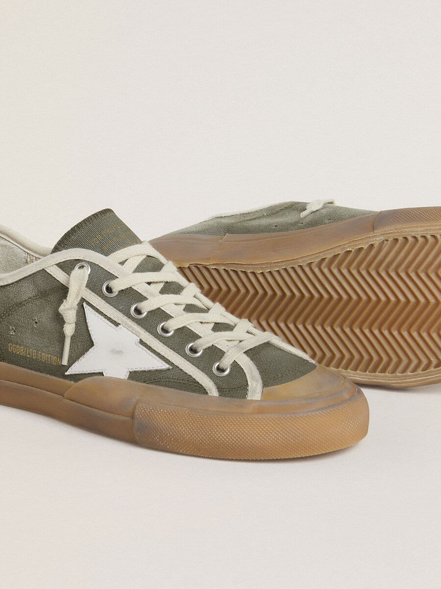 dames super-star ltd in groen canvas met witte leren ster