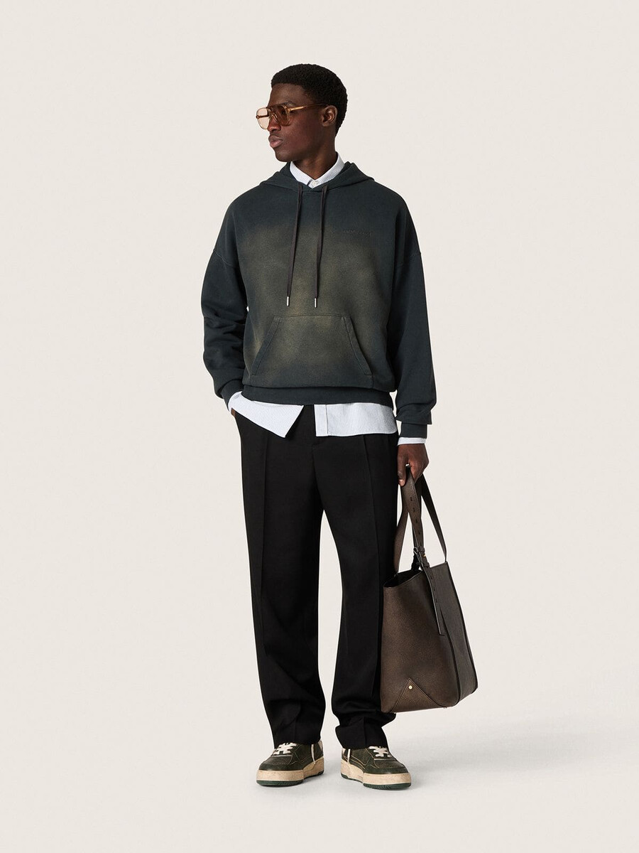 unisex hoodie van zwart katoen met een gebleekt effect.
