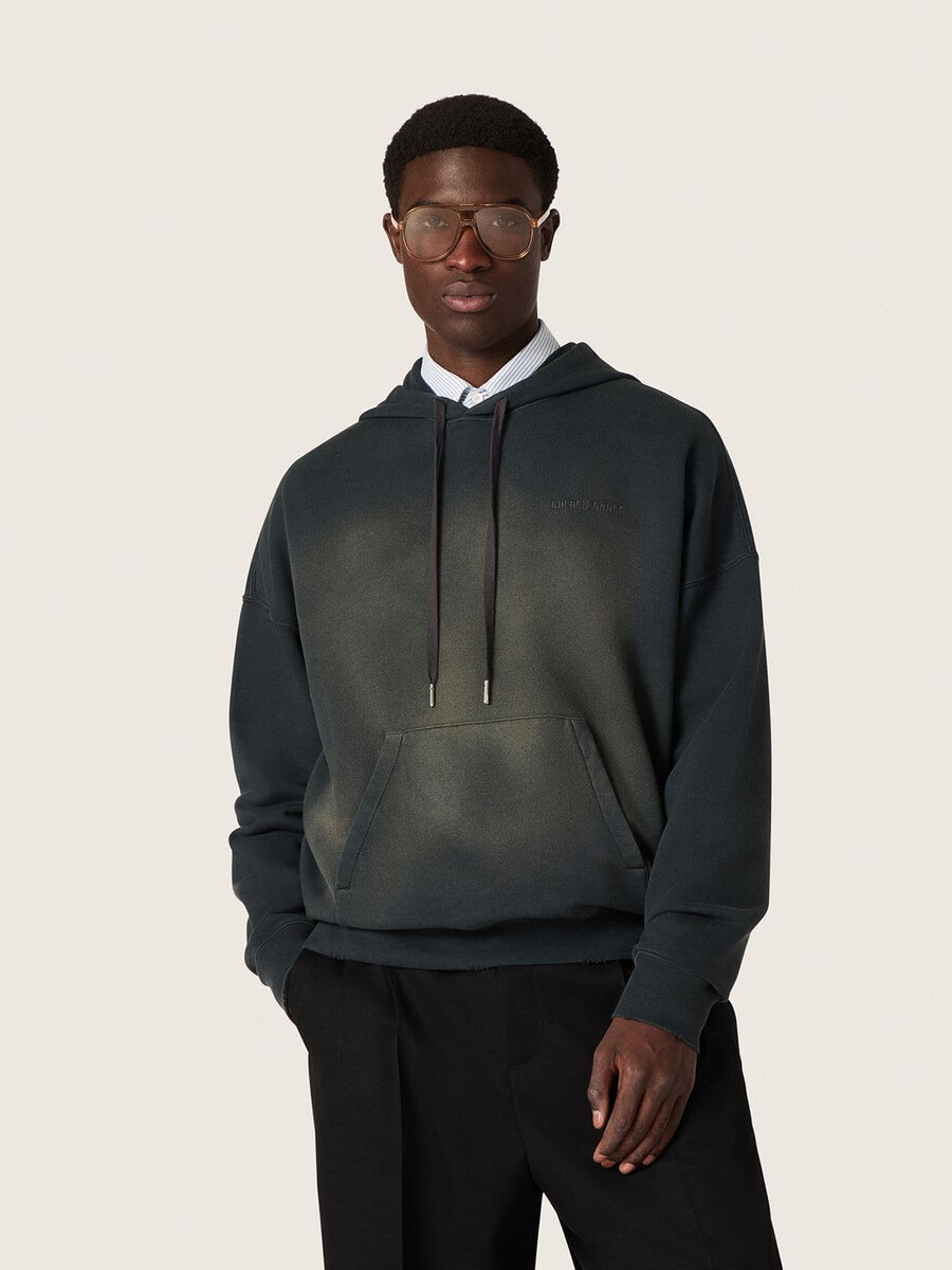unisex hoodie van zwart katoen met een gebleekt effect.