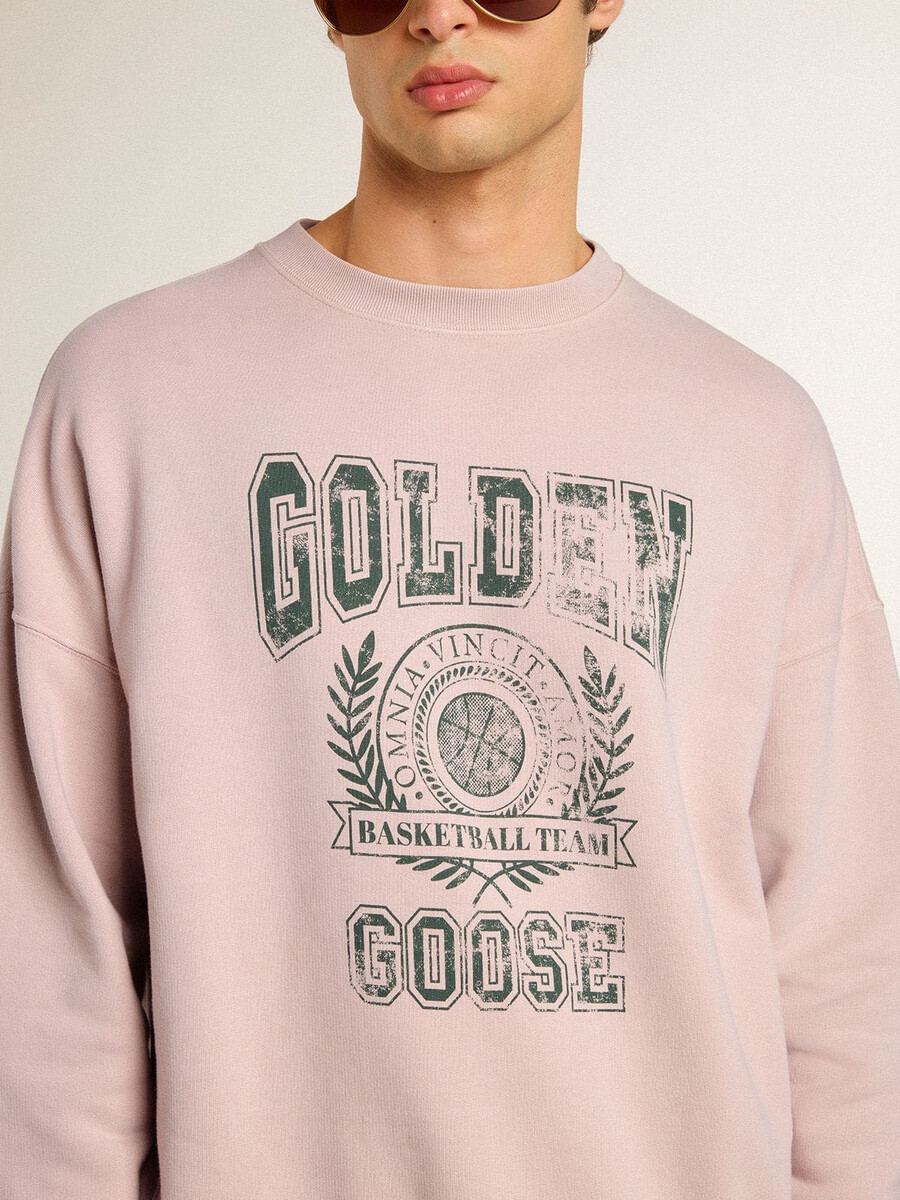 oudroze unisex sweatshirt met ronde hals en groene logo-opdruk.