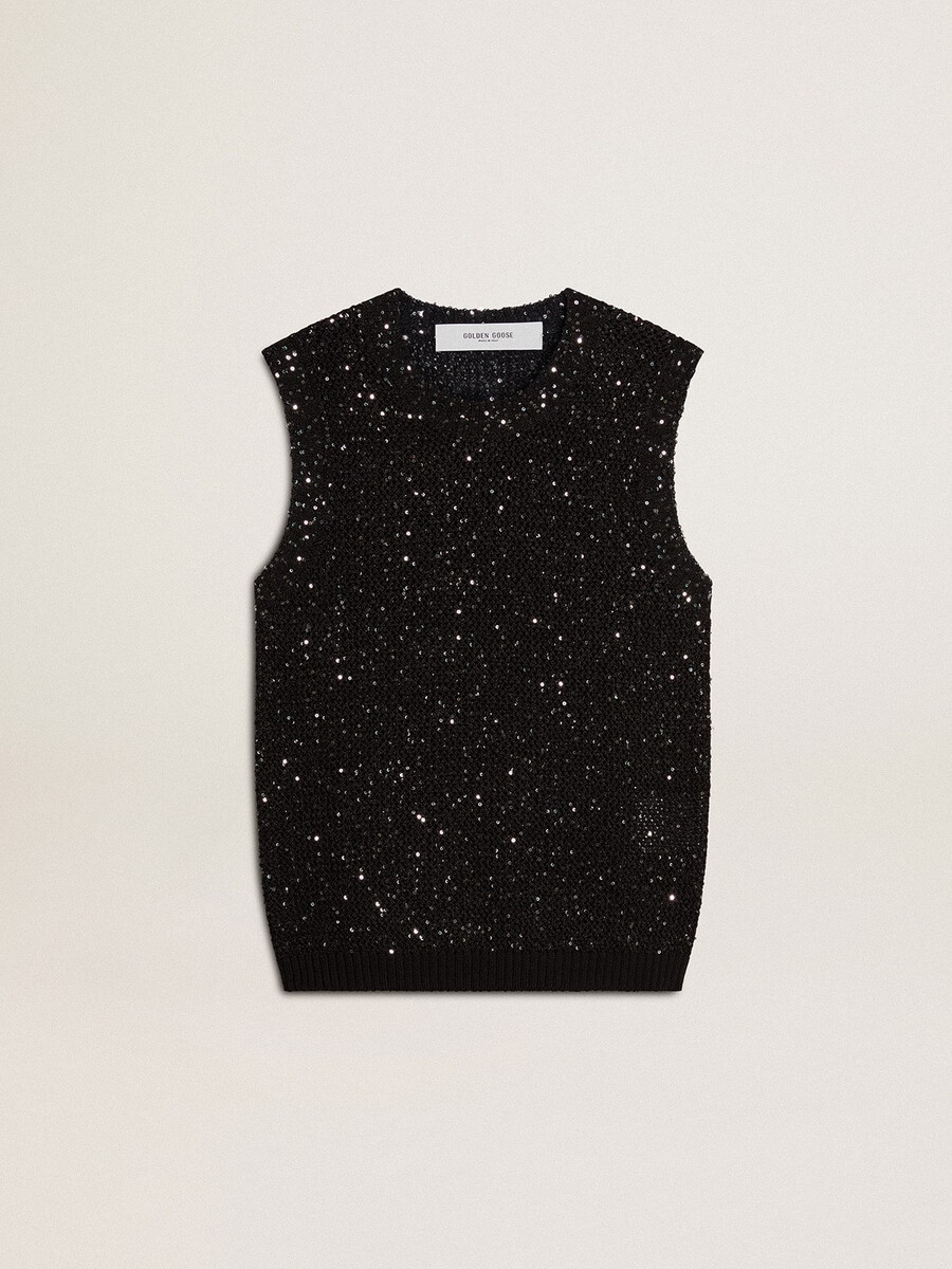 zwarte top van mesh-stof met pailletten en contrasterende details.