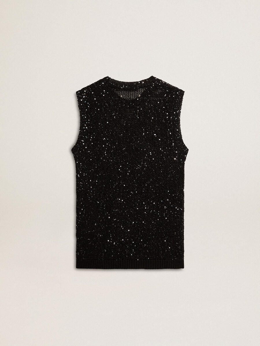 zwarte top van mesh-stof met pailletten en contrasterende details.
