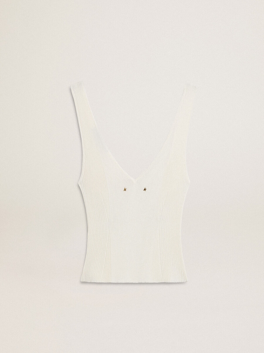 mouwloze top geborduurd met versleten witte ribbels.