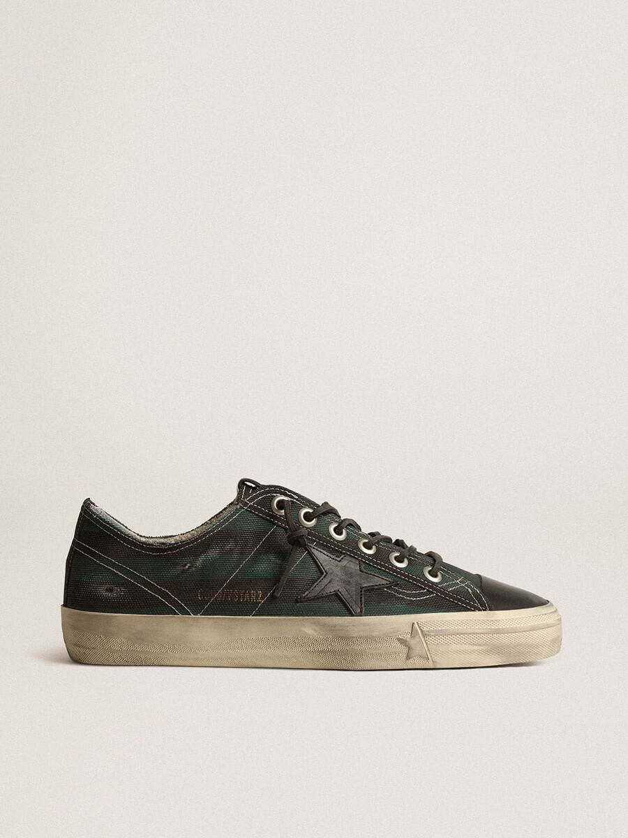 heren v-star in zwart en groen gestreept canvas met zwarte leren ster en neus.