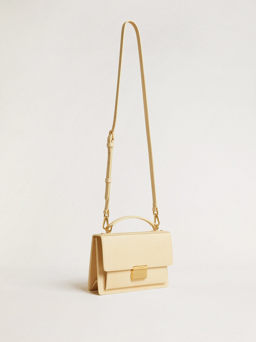venezia-tas in beige leer met pythonprint en gouden details.