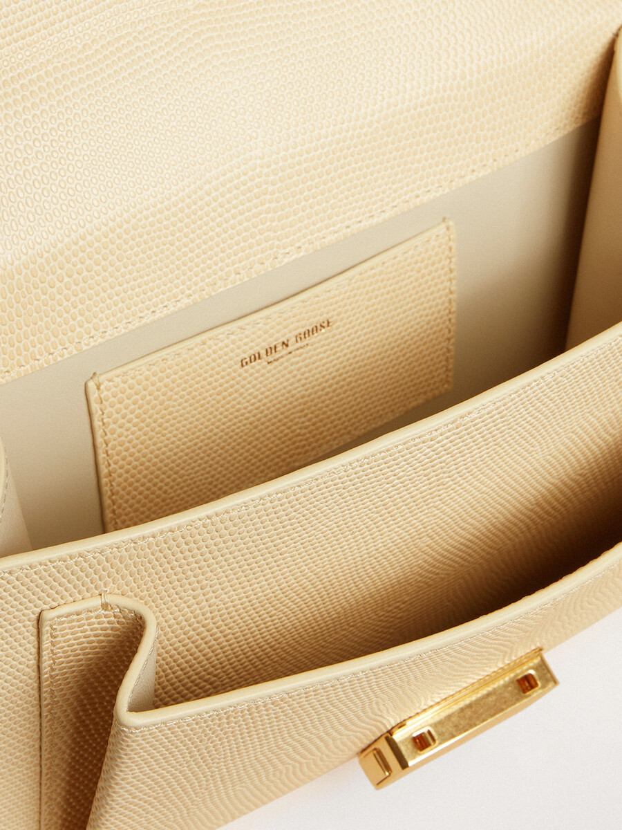 venezia-tas in beige leer met pythonprint en gouden details.